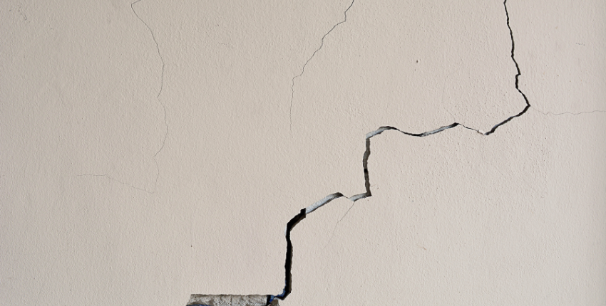 White wall with a large diagonal crack