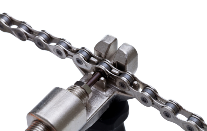 Bicycle chain placed on a chain tool